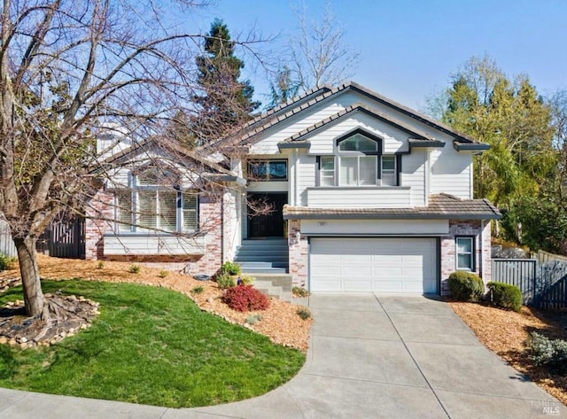 view of front of house featuring a garage and a front lawn