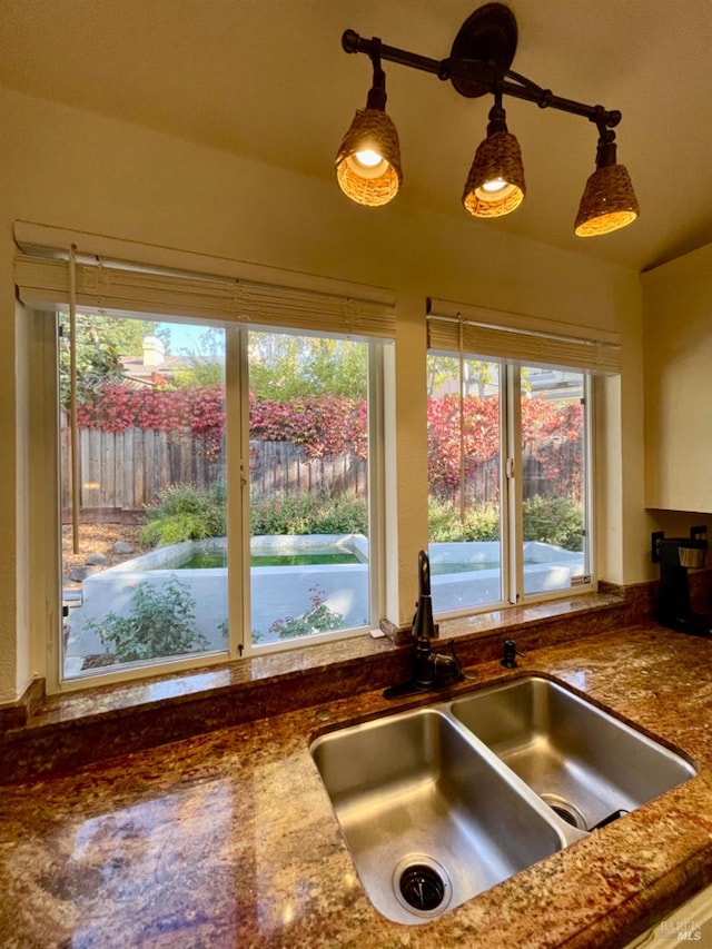 kitchen featuring sink and hanging light fixtures