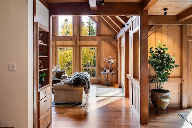 interior space featuring vaulted ceiling with beams