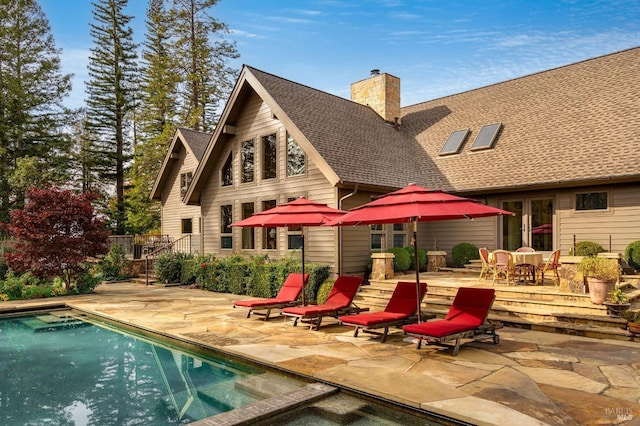 back of house with a patio area