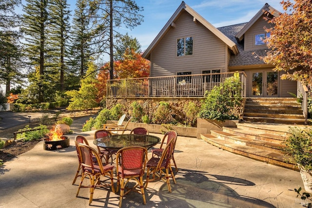 view of patio / terrace with a fire pit