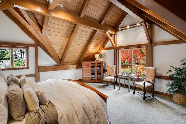 bedroom with beam ceiling, carpet floors, wood ceiling, and multiple windows