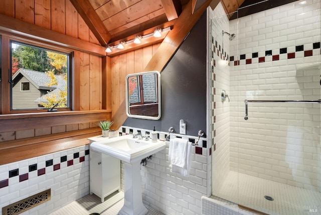 bathroom featuring tile patterned floors, wood walls, an enclosed shower, lofted ceiling, and wood ceiling