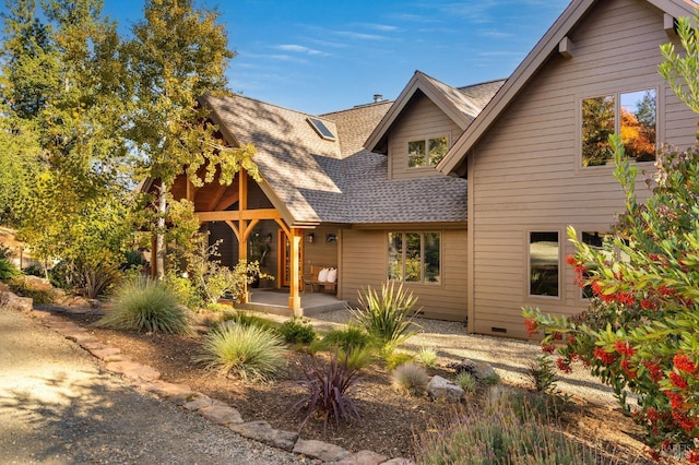 rear view of house featuring a patio