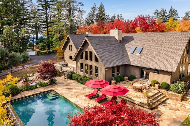 back of house with a patio area and french doors