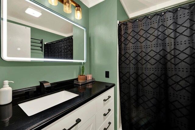 bathroom featuring vanity and curtained shower