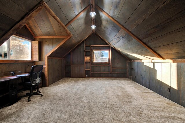 unfurnished office featuring lofted ceiling, wood ceiling, carpet, and wood walls