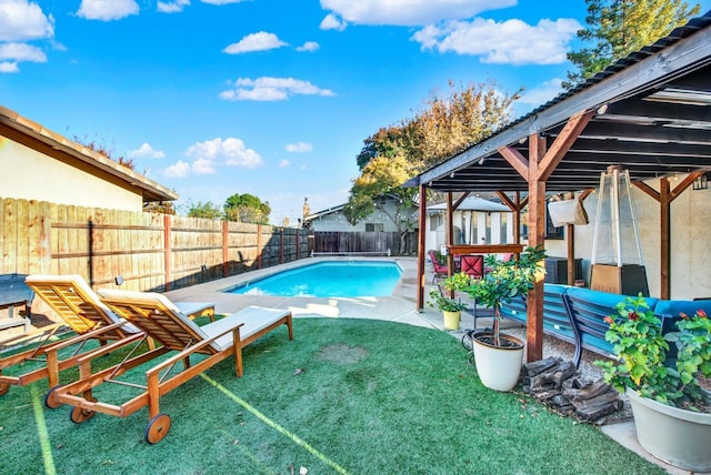 view of pool with a yard