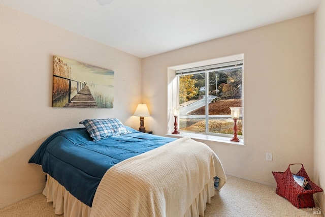 bedroom featuring light colored carpet