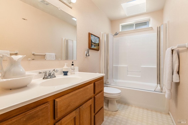 full bathroom with vanity, toilet, enclosed tub / shower combo, and a skylight