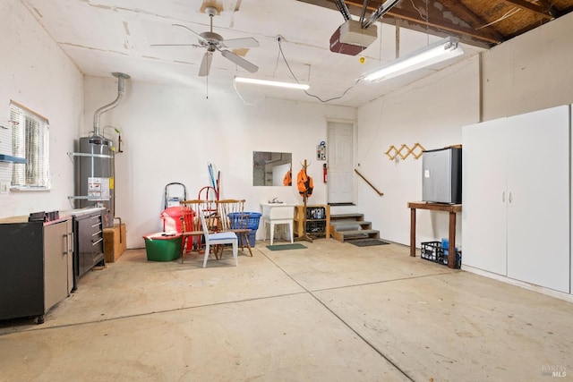 garage with water heater, ceiling fan, and a garage door opener