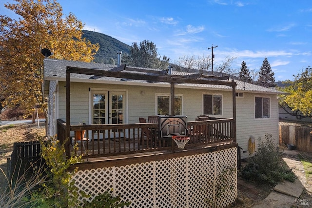 back of house featuring a deck with mountain view