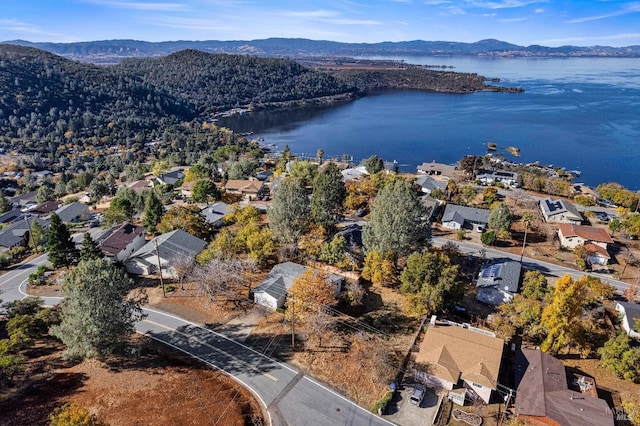 drone / aerial view with a water and mountain view