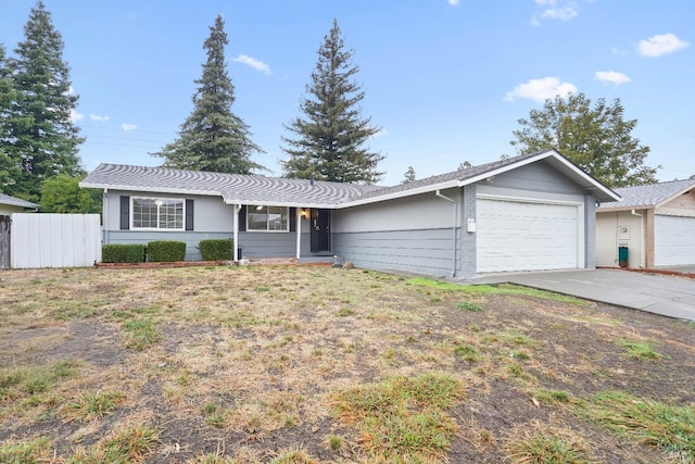 ranch-style house featuring a garage