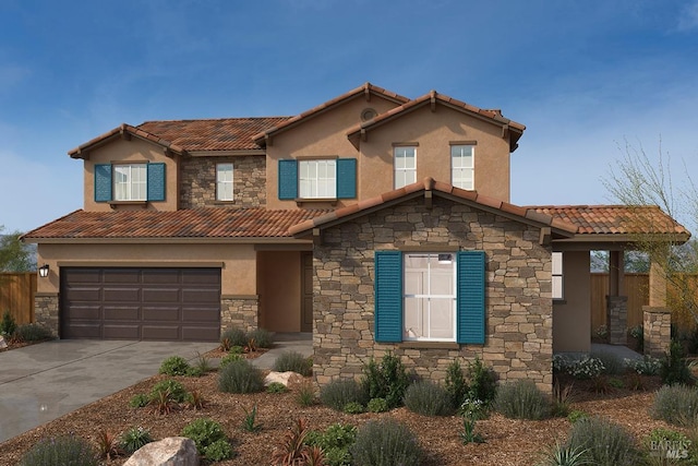 mediterranean / spanish house with a garage