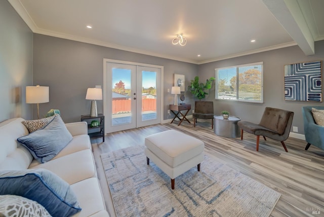 living room with french doors, light hardwood / wood-style floors, crown molding, and beam ceiling