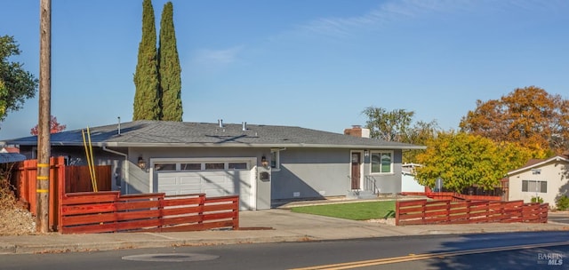 ranch-style house featuring a garage