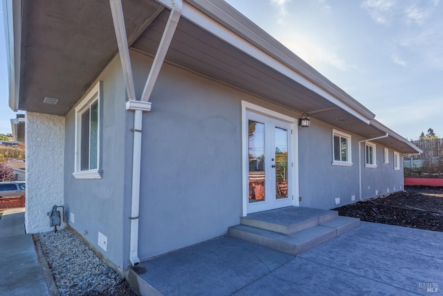 view of home's exterior featuring french doors