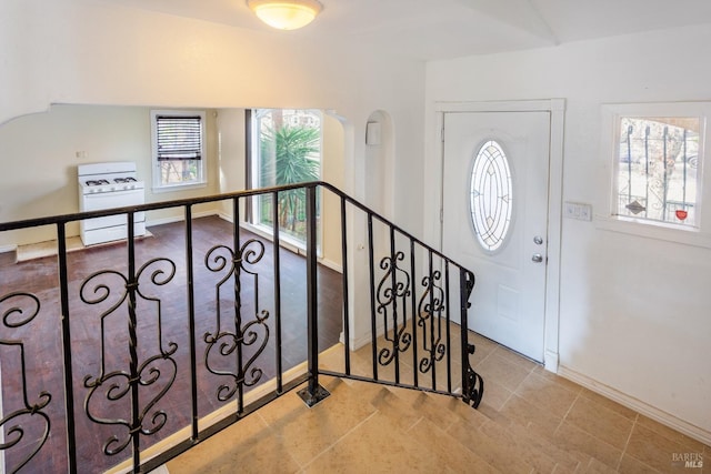 interior space with light tile patterned floors and plenty of natural light