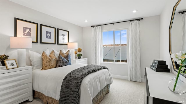 bedroom featuring light carpet