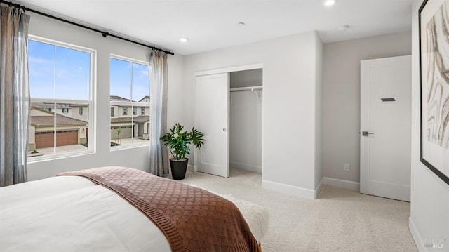 carpeted bedroom featuring a closet