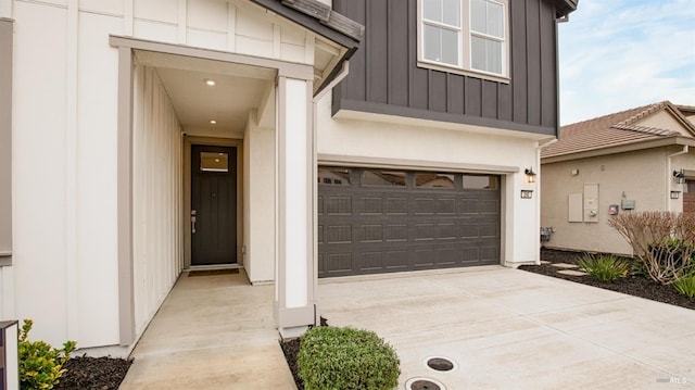 view of exterior entry featuring a garage