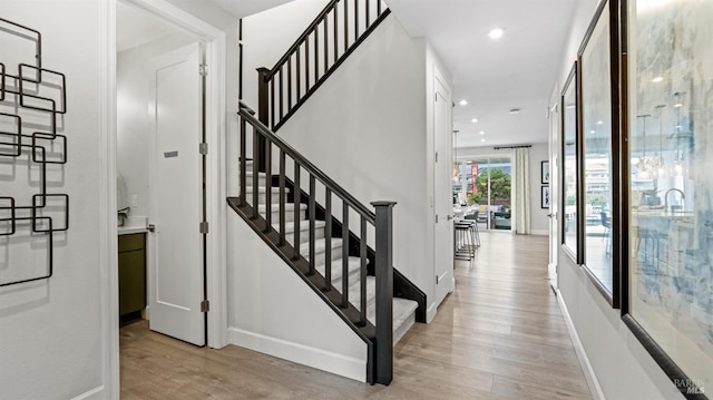 staircase featuring hardwood / wood-style flooring