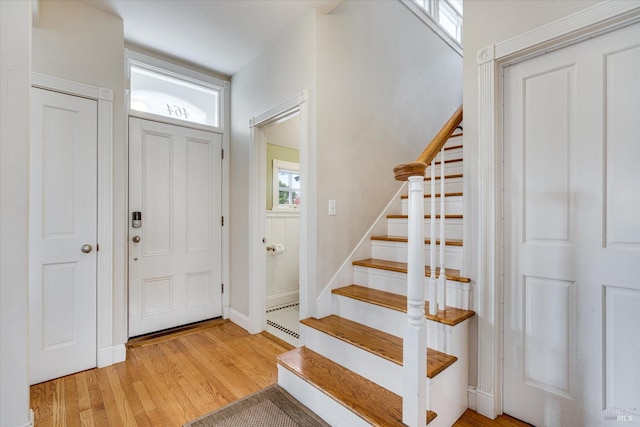 foyer featuring a healthy amount of sunlight and light wood-type flooring