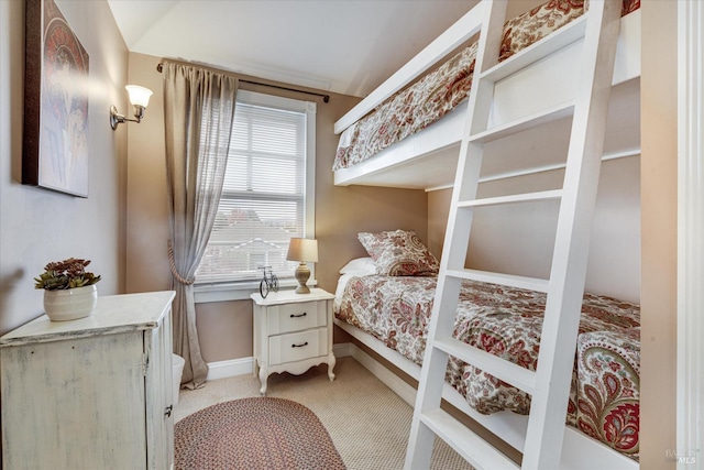 bedroom featuring light colored carpet