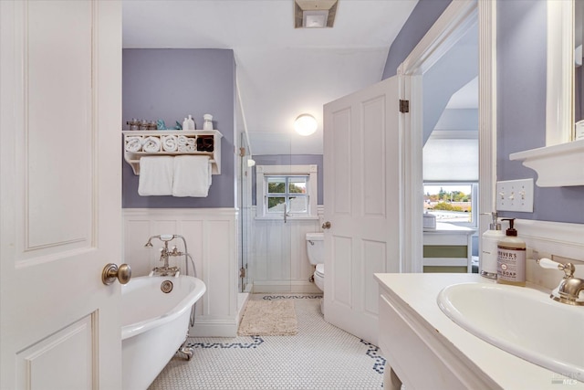 full bathroom with tile patterned floors, vanity, toilet, and shower with separate bathtub