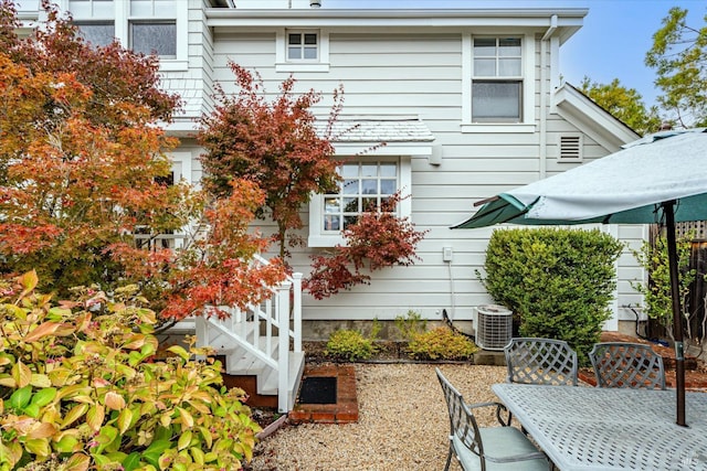 view of home's exterior with central AC