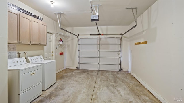 garage with baseboards, washer and dryer, and a garage door opener