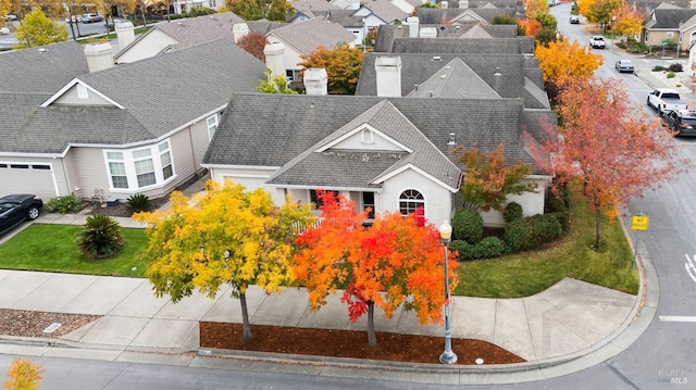 birds eye view of property with a residential view