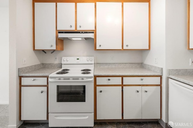 kitchen featuring white cabinets and white appliances