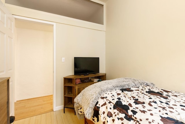 bedroom with hardwood / wood-style floors