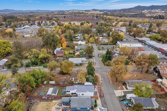 birds eye view of property with a mountain view