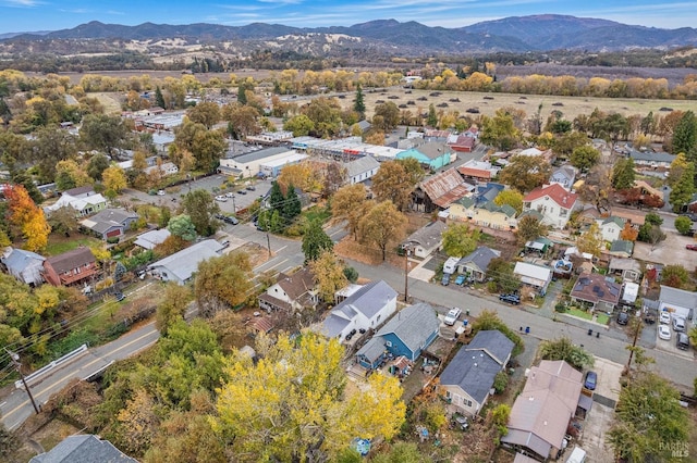 birds eye view of property with a mountain view