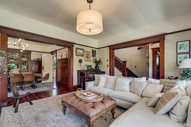 living room featuring hardwood / wood-style flooring and a notable chandelier