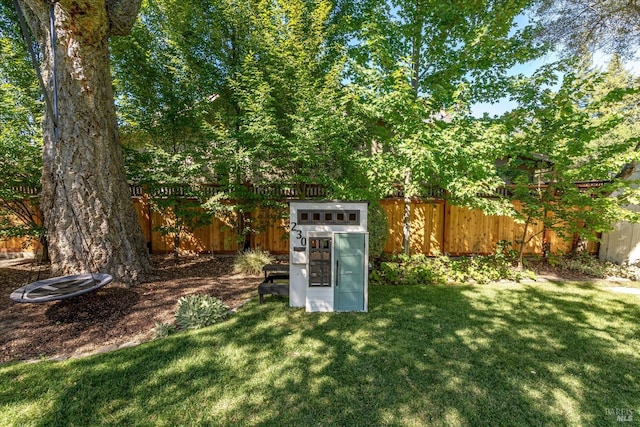 view of outbuilding featuring a lawn