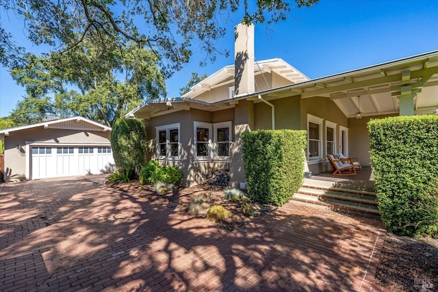 back of property featuring a garage