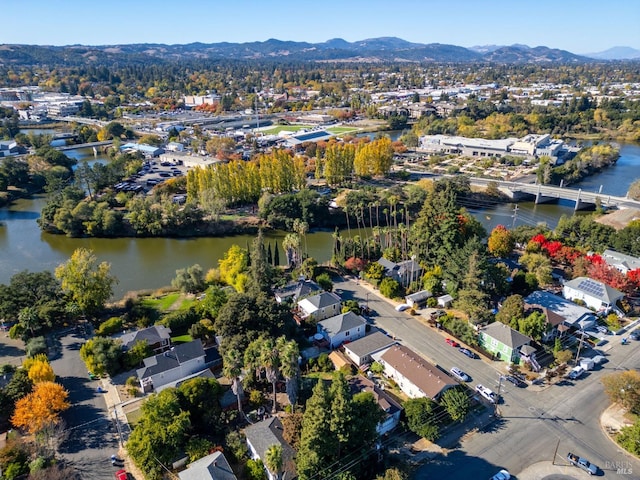 bird's eye view with a water and mountain view