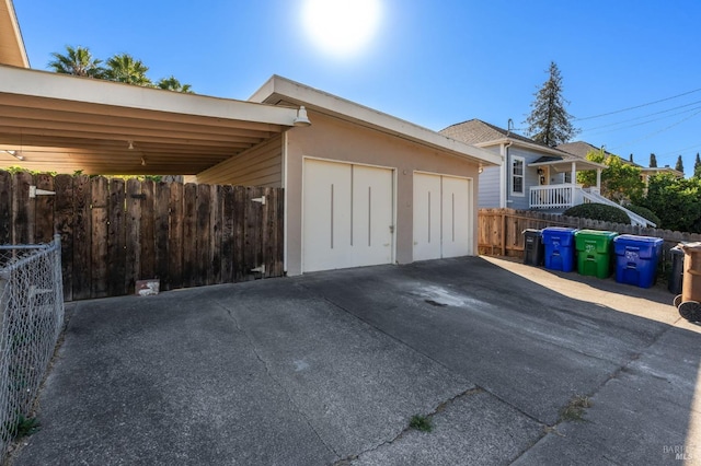 garage featuring a carport