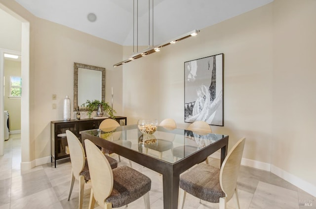 dining space featuring baseboards