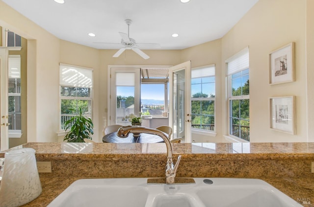 room details featuring recessed lighting, a ceiling fan, and a sink