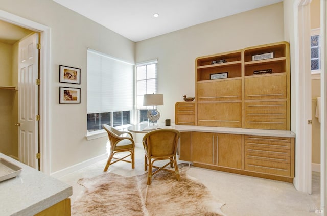 office featuring light colored carpet and baseboards