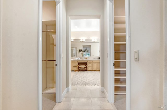 corridor featuring light tile patterned flooring