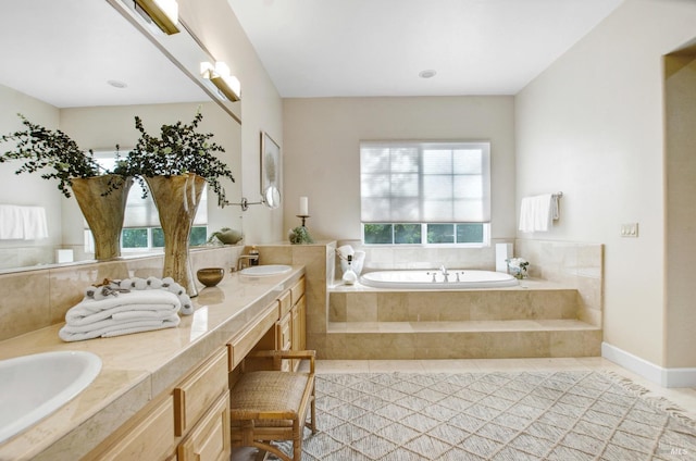 full bath with tile patterned flooring, double vanity, a bath, and a sink