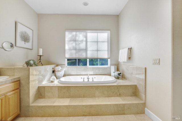 bathroom featuring a bath, tile patterned flooring, and vanity