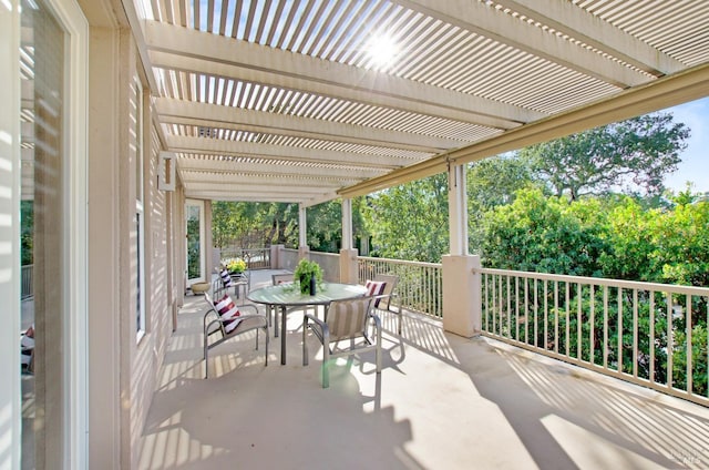 view of patio with outdoor dining space and a pergola