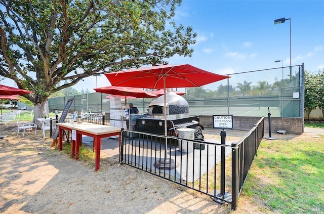 surrounding community featuring a carport and fence